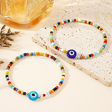 Colorful handmade beaded bracelet with devil eye design, unique accessory.